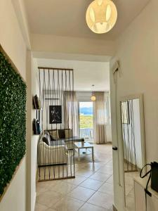 a living room with a couch and a table at Electra The Seaside Apartments in Sarandë