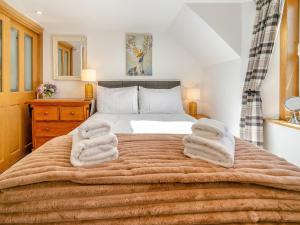 Katil atau katil-katil dalam bilik di Ardlevale Cottage +8 gambar