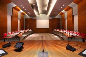 a conference room with a large table in the middle at The Chedi El Gouna in Hurghada +37 photos