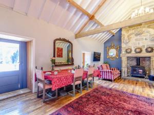 a dining room with a table and a fireplace at Lady De Seton - Uk31956 in Staithes