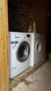 a washer and dryer sitting in a house at A L'Ombre Du Figuier in Saint-Thois