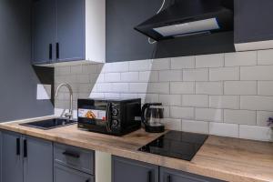 Η κουζίνα ή μικρή κουζίνα στο Уютная около Арбата, ЖК Меридиан