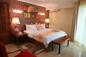 Postel nebo postele na pokoji v ubytování Grand Hôtel Aéroport, Douala