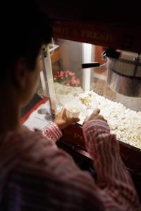 a person is putting food into a food machine at M'AR De AR Muralhas in Évora +68 photos