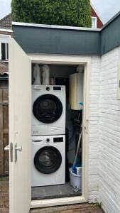 a washer and dryer inside of a house at Large Family House Alkmaar in Alkmaar