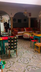 a living room with a bed and chairs in a room at Riad SULTANA lateral seaview in Saidia  +194 photos