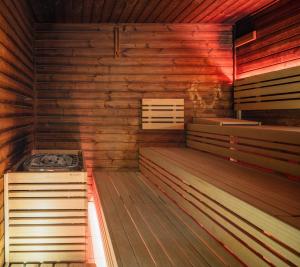 an empty sauna with wooden walls and wooden floors at OREA Hotel Pyramida Praha in Prague