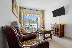TV a/nebo společenská místnost v ubytování Playa Dorada B106
