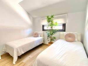 Ένα ή περισσότερα κρεβάτια σε δωμάτιο στο Ático con piscina en Fuengirola +6 φωτογραφίες