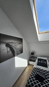 Postel nebo postele na pokoji v ubytování Apartament Slowinski