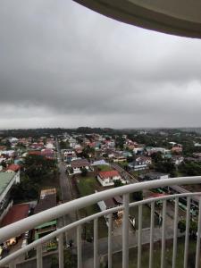 a view of a city from a balcony at Jhohanna's Cozy Corners in Iruhin +7 photos