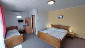 Ένα ή περισσότερα κρεβάτια σε δωμάτιο στο Hotel Zámeček