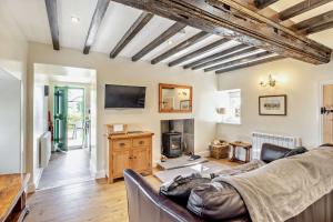 TV a/nebo společenská místnost v ubytování Hobcroft Cottage