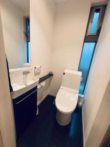 a small bathroom with a toilet and a sink at Ikebukuro池袋1stop-2min-Kitaikebukuro北池袋walk3min in Tokyo
