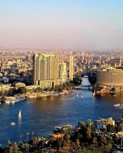a view of a river with buildings and a city at Gardenia Hotel in Cairo