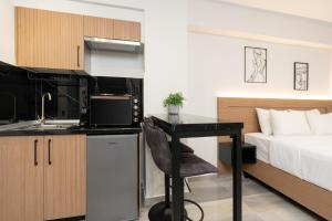 Η κουζίνα ή μικρή κουζίνα στο TOWER 15 Suites, Nilie Hospitality MGMT