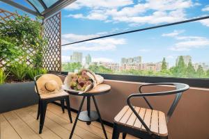 Balkón nebo terasa v ubytování Kunming Spring City Boutique Hotel