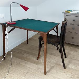 a desk with a chair and a lamp on it at La Petite Fontaine in Senlis