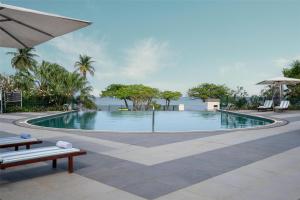 a swimming pool with a view of the ocean at Park Inn by Radisson Libreville in Libreville