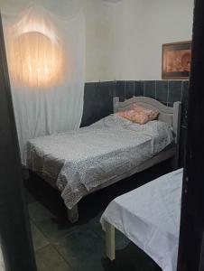 Postel nebo postele na pokoji v ubytování Hospedagem Liberdade