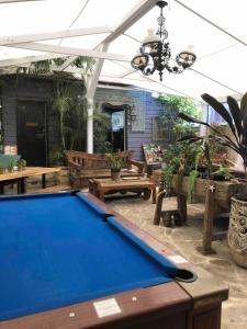 a pool table in the middle of a patio at Keiraleagh House in Wollongong