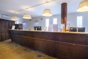 a bar in an office with pendant lights at Résidence Pierre & Vacances Premium Port Prestige in Antibes