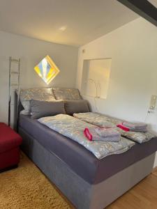 Katil atau katil-katil dalam bilik di Ferienhaus Weserblick, Haus Zander