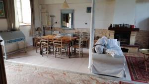 a living room with a couch and a table at Les Ecuries de Montdoucet in Souancé-au-Perche