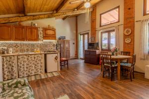 a kitchen and living room with a table and chairs at Casa di Cristina in Casamaggiore