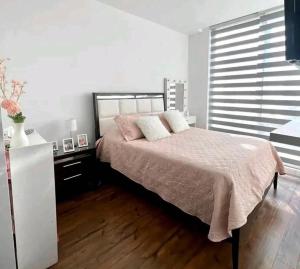 Giường trong phòng chung tại La Panaca Del Inka Apartment