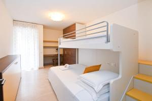 a small room with a bunk bed and a desk at Luxurious Lugano Apartment with City Views in Lugano