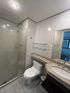 a bathroom with a toilet and a shower and a sink at Hotel Moema Shopping Ibirapuera Com Garagem 1420 in Sao Paulo