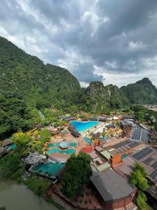 an aerial view of a resort with two swimming pools at Sunway Onsen Ipoh by EUcation Hospitality in Tambun