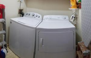 a white washer and dryer in a small kitchen at Seasons In The Sun in North Myrtle Beach