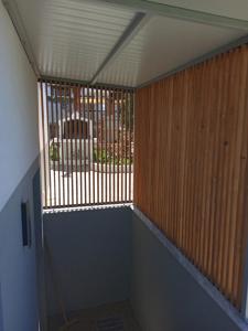 a room with a room with a window with wooden walls at Modern Summer House Kalimera in Epanomi