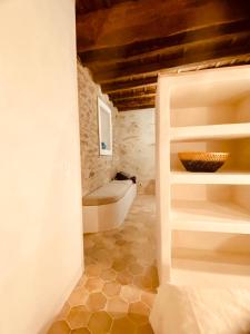 a bathroom with a toilet and a bowl on a shelf at Citabella Bastia in Bastia +15 photos
