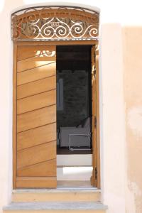 an open door into a room with a bed at Citabella Bastia in Bastia