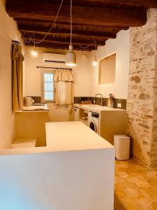 a kitchen with a white counter in a room at Citabella Bastia in Bastia