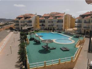 an overhead view of a large swimming pool with umbrellas at Pandora Ocena View II in Sal Rei