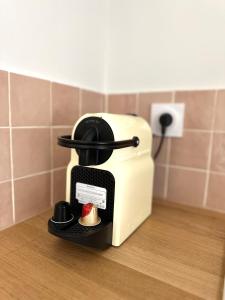 a toaster sitting on a counter with a apple in it at Il Piccolo - Cosy emplacement de rêve in Bandol +32 photos