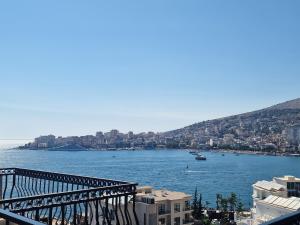 a view of a large body of water with buildings at Duplex Penthouse with Jacuzzi in Sarandë