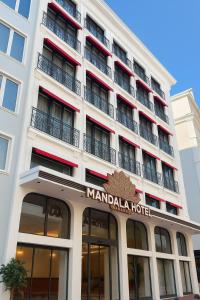 a large white building with a marmalade hotel at Mandala Karaköy Hotel in Istanbul