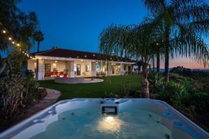 a bath tub in the yard of a house at The Grape Escape Panoramic Views In Wine Country in Temecula