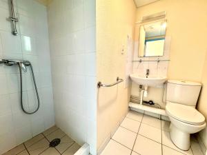 a bathroom with a toilet and a sink at La Vallée Appartement 31 - Thermes Neyras les Bains in Meyras