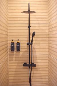 a black hair dryer hanging on a wall at Luz Marina in Ribadeo +37 photos