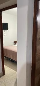 Una cama o camas en una habitación de Hospedaje lupe