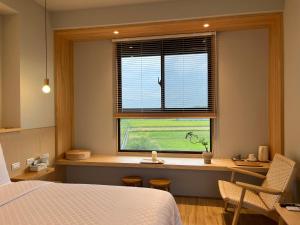 Postel nebo postele na pokoji v ubytování 不想上班 宜蘭民宿-Don't Wanna Work B&B