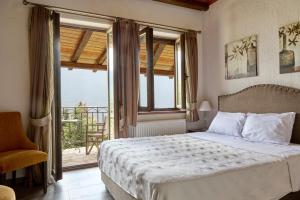 Posteľ alebo postele v izbe v ubytovaní Omalia Village