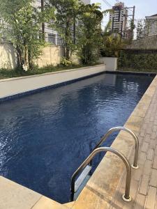 a swimming pool with blue water in a building at Apart-Hotel Vila Mariana in Sao Paulo +15 photos