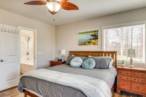 a bedroom with a bed and a window at Private Dock, Fire Pit Lake Murray Family Escape! in Lake Murray Shores